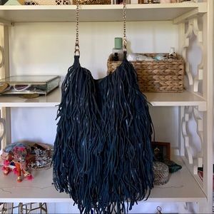 Blue leather fringe purse.  Very spacious!